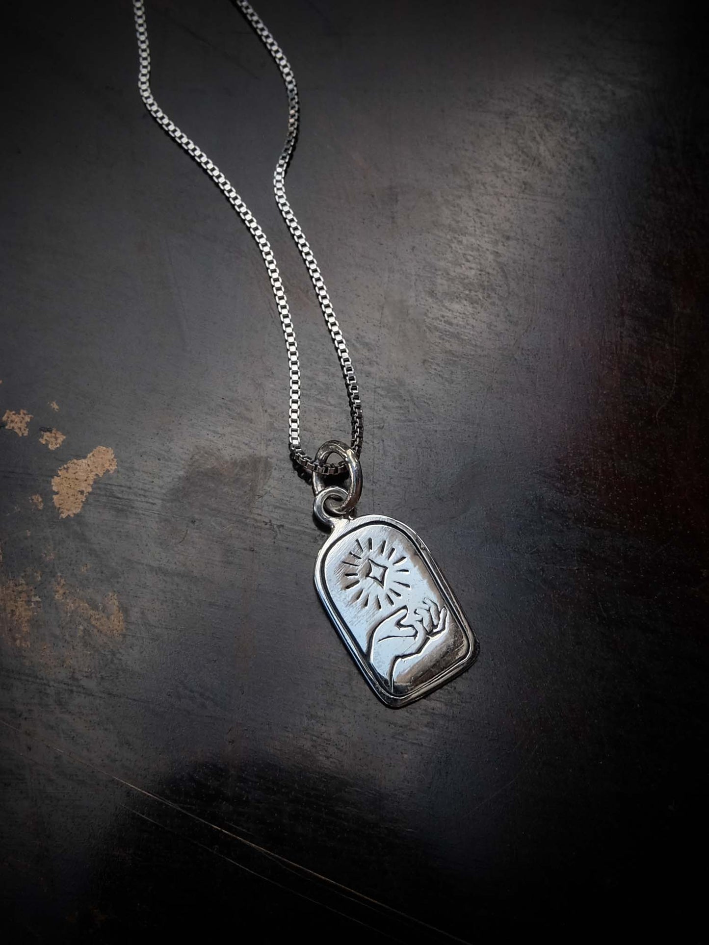 Hand of Light Charm in Silver
