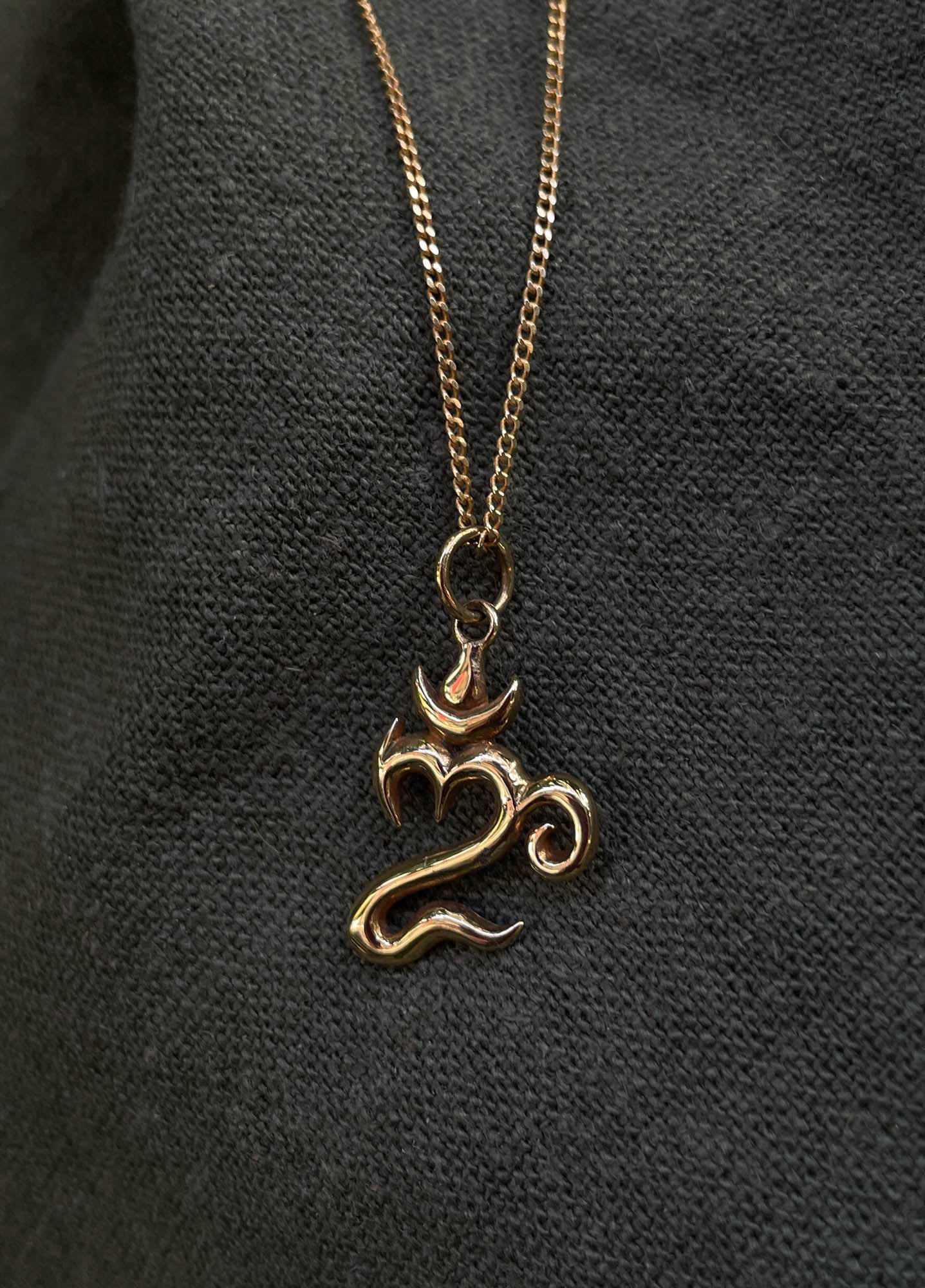 Bali Om Pendant in Brass
