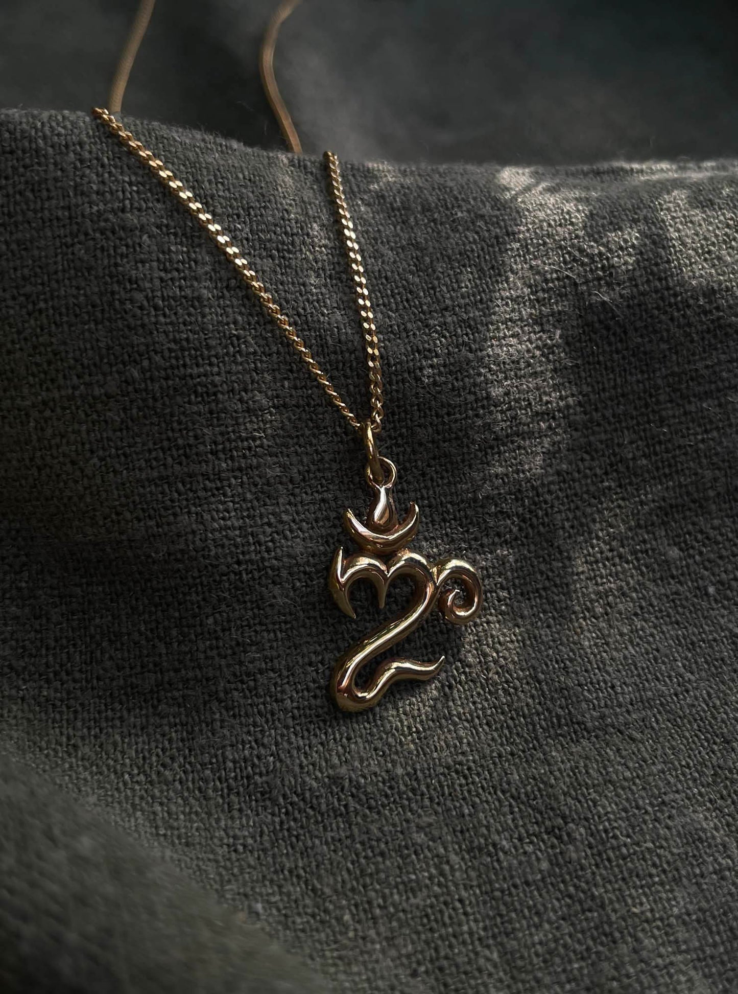 Bali Om Pendant in Brass